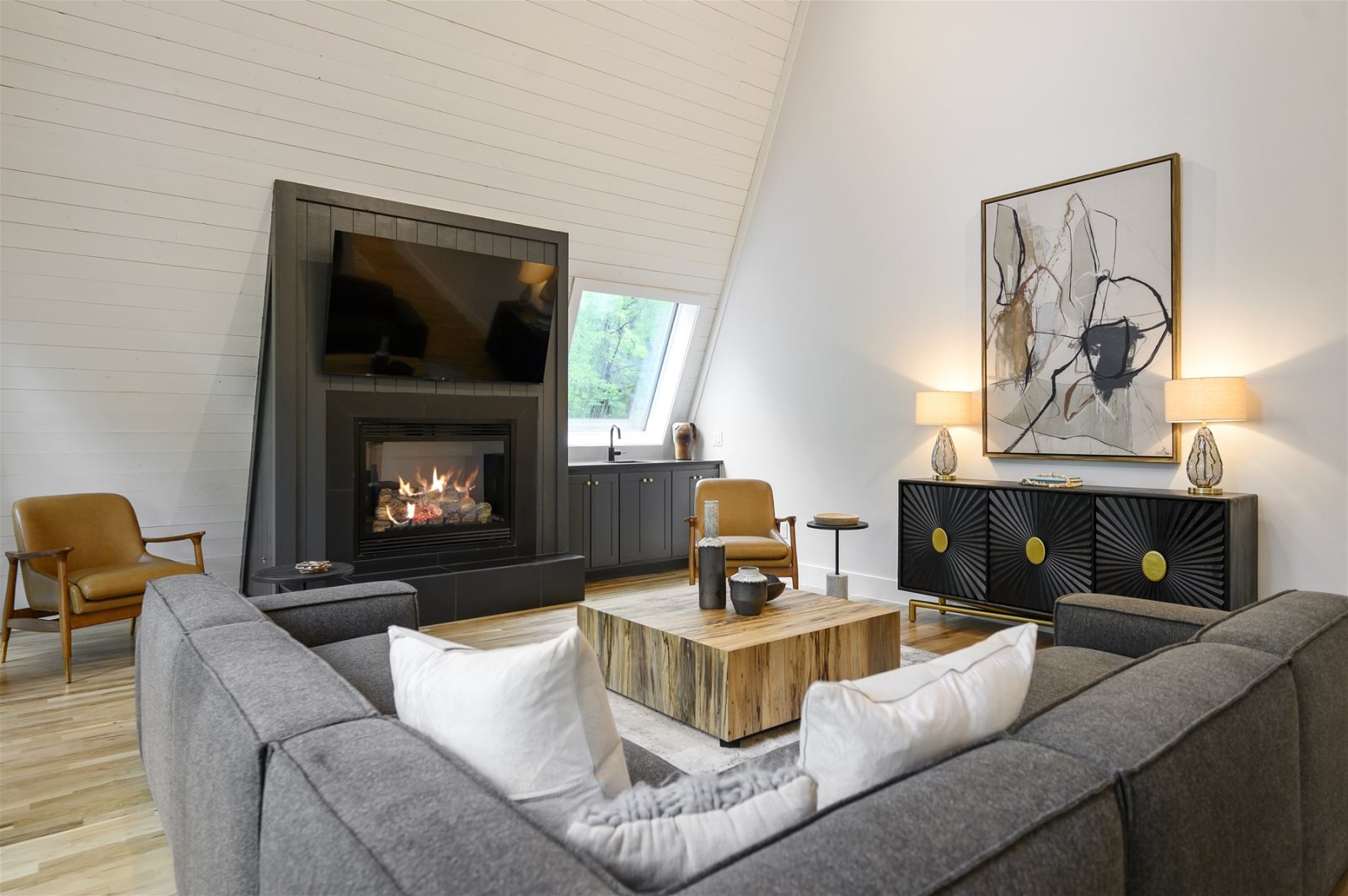 Living area with a fireplace and sectional